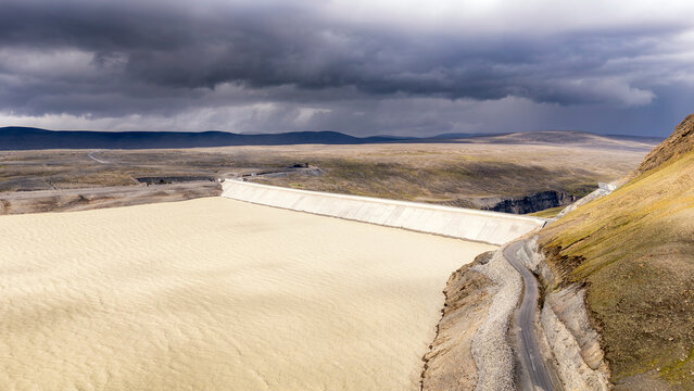 K�rahnj�kar Dam and H�lsl�n reservoir under dramatic storm clouds in Iceland