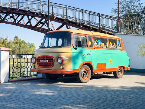 Samar, Ukraine &ndash; July 10, 2025: old van with The Simpsons stickers on riverside embankment in summer