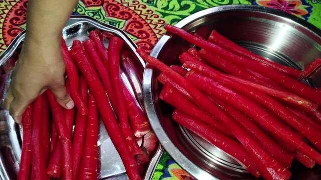 close up of a bunch of red Indian carrots. These carrots have extra antioxidants pigments that may benefit diseases like arthritis and many heart diseases. ( With Original Background Sound )
