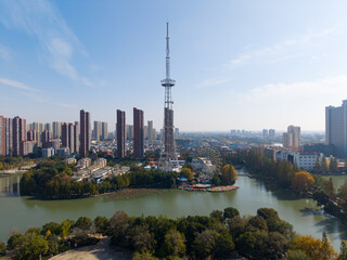 Fototapeta premium Aerial view of Tianmen City, Hubei Province skyline with a prominent tower and river