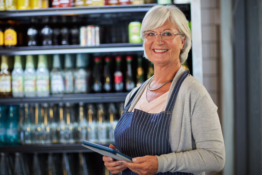 Barista, portrait and old woman with tablet, cafe or happy for small business development and online. Coffee shop, entrepreneur and senior person with tech for stock inventory, order and smile in USA