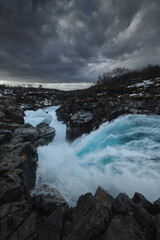 Fototapeta premium Bruarfoss waterfall in Iceland. Famous for its brilliant icy blue water swirling into a deep crevice. A hidden gem near the Golden Cir
