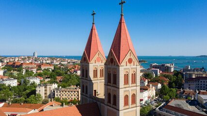 Catholic Church Towers, Qingdao Cityscape with Coastal Views © CaoVan