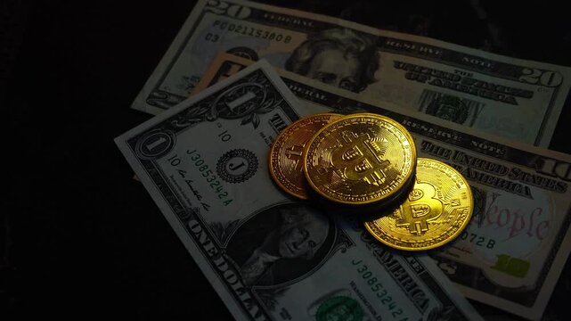 Bitcoin BTC coin with 100 dollars bills. Digital crypto coin and cryptocurrency. Investments for the investor. Concept of exchange market and online trading. Trading in bull and bear markets