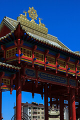 Fototapeta premium Red wooden gate to the Buddhist temple of Elista