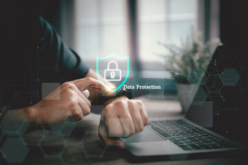 Person using smartwatch with data protection concept and laptop in office