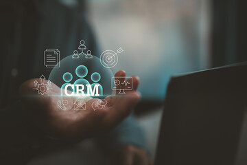 Customer Relationship Management Concept with Digital Icons and Hand Holding CRM Visualization
