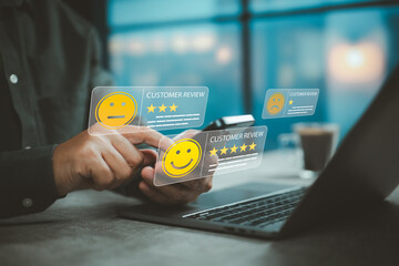 Person using smartphone and laptop with digital customer review ratings interface