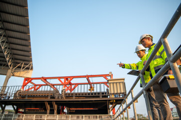 Naklejka premium Engineering Team Conducting Industrial Infrastructure Inspection for Asset Management