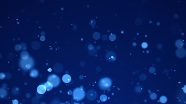 Magical blue glowing particles and bokeh bubbles rising on a deep blue background.