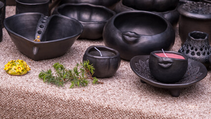 Modern handmade black ceramic bowls and candles