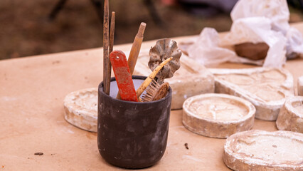 Artisan pottery tools and clay molds display