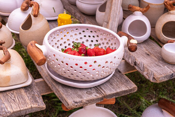 Artisan pottery sculpting tools in dark container