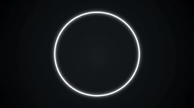 Glowing white circle on a black background with a bright rim and empty space below.