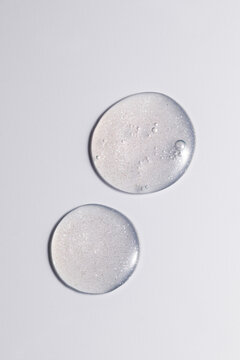 Macro shot of  facial serum swatch with glossy texture on a clean background