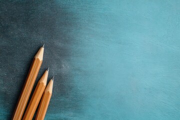 Three Unsharpened Wooden Pencils Leaning On Glittering Blue Surface Creative Art Supplies Crafting Concept Background