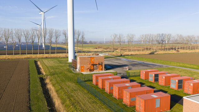 Wind turbines and battery storage facility distributing renewable energy