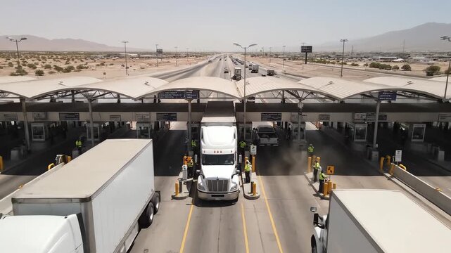 Border checkpoint with vehicles and staff