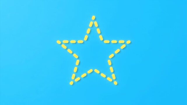 Star shape made of yellow objects against a blue background