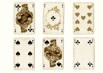 A hand of vintage playing cards in sepia isolated on a white background.