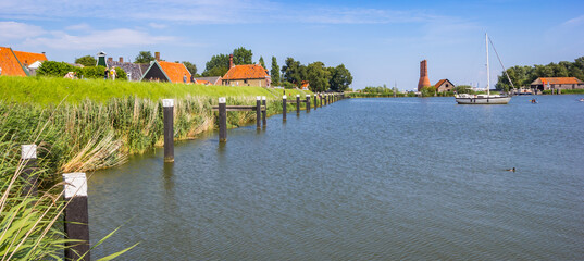Panorama of the dike at the IJsselmeer lake in Enkhuizen, Netherlands © venemama