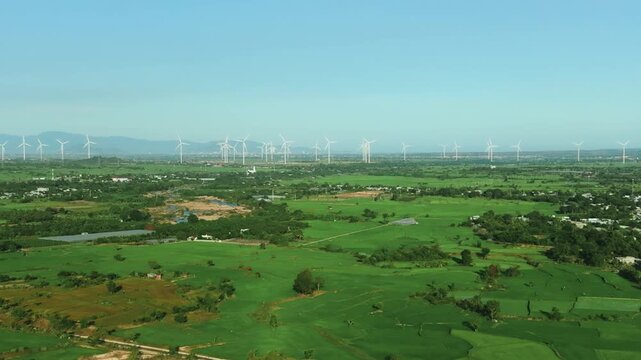Aerial 4K Wind Turbine Farm Beside Modern Cam Lam - Vinh Hao Expressway, Vietnam
a massive wind farm with rotating turbines situated along the newly completed Cam Lam - Vinh Hao Expressway in Vietnam