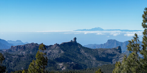 Vast volcanic mountain landscape above the clouds