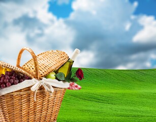 Obraz premium Beautiful cute picnic set on green grass in park