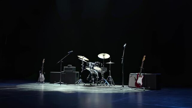 Empty stage with musical instruments set up for a live performance. Represents the anticipation and excitement of a concert atmosphere