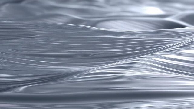 Smooth flowing silver waves creating a mesmerizing abstract background. Ideal for conveying elegance, fluidity, and modernity in design projects
