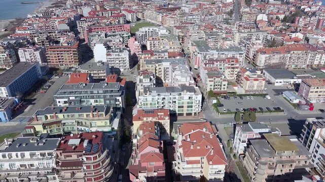View from a height of the city of Pomorie with many cars, houses and hotels