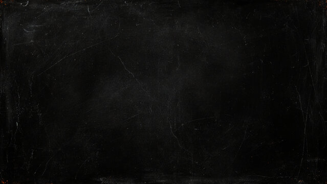 Dark scratched and distressed old black stone wall texture background
