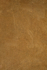 Close up of a rough brown suede leather surface with natural fibers and a vintage feel from an old bag or garment