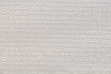 Close up of a clean white fabric texture with a fine woven canvas pattern suitable for textile backgrounds and creative design