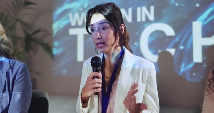 Group, women and speaker for conference event of discussion, coaching audience and public speaking. People, mic or tablet with speech on stage, global learning and convention lecture of planet advice