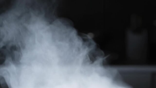 White smoke billowing in a dark background. Represents mystery, transformation, and the essence of cooking or brewing processes