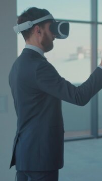 Professional in formal attire demonstrates advanced virtual workspace features to prospective clients and investors
