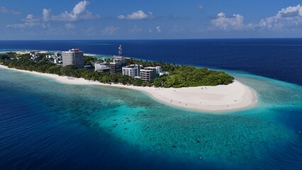 Aerial drone view of Ukulhas Maldives tropical island with white sand beach and coral reef © FunViralContent