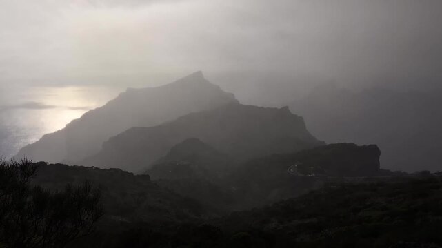 Beautiful sunset over the green volcanic landscape in Masca valley, Tenerife, Spain. Aerial view of Tenerife island landscape. Travel destination, Canary islands scenery