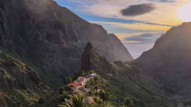 Landscape of the Masca valley in Tenerife, Canary island, Spain. Scenic mountain landscape with palm trees and tropical vegetation in Tenerife. Famous volcanic rock formation in Masca village