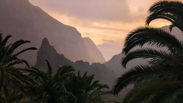 Landscape of the Masca valley in Tenerife, Canary island, Spain. Scenic mountain landscape with palm trees and tropical vegetation in Tenerife. Famous volcanic rock formation in Masca village