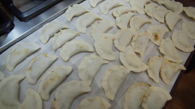 Handmade pierogi dumplings being prepared step by step
