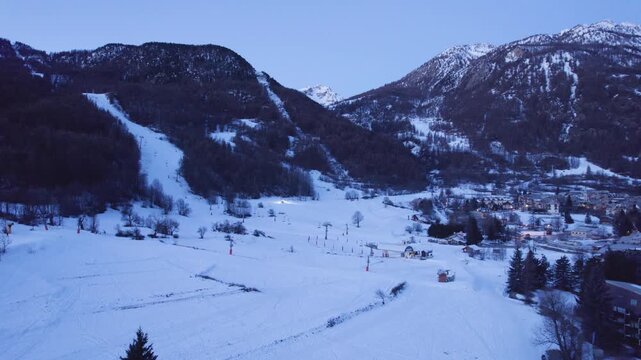 Serre Chevalier Ski Resort at Dawn, Slopes Finish Being Groomed - Aerial Drone Shot