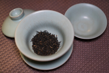 Gaiwan on the tea table selective focus. Gongfu cha tea ceremony. Chinese ceramics of Zhu Yao....