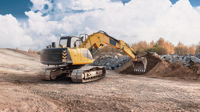 Excavator digs into the earth at a construction site while sunlight breaks through clouds. The area shows signs of ongoing work and machinery use
