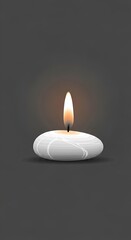 Single lit white candle on a dark background, creating a serene and peaceful atmosphere.