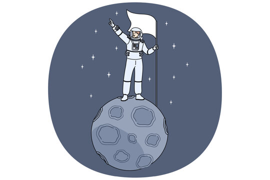 Man astronaut stands on miniature moon in space and holds flag pointing towards endless galaxy. Astronaut guy dressed in spacesuit who was in orbit for first time and went into open cosmos