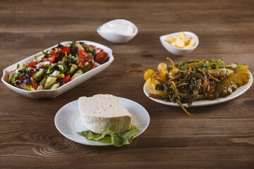 Traditional caucasian dishes on a wooden table .