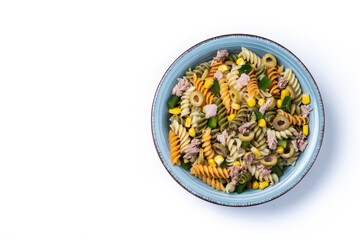Pasta salad with tuna, corn and olives in bowl isolated on white background. Top view. Copy space