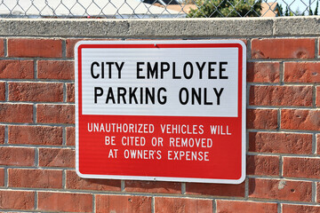 City Employee Parking Only sign outside municipal facilities